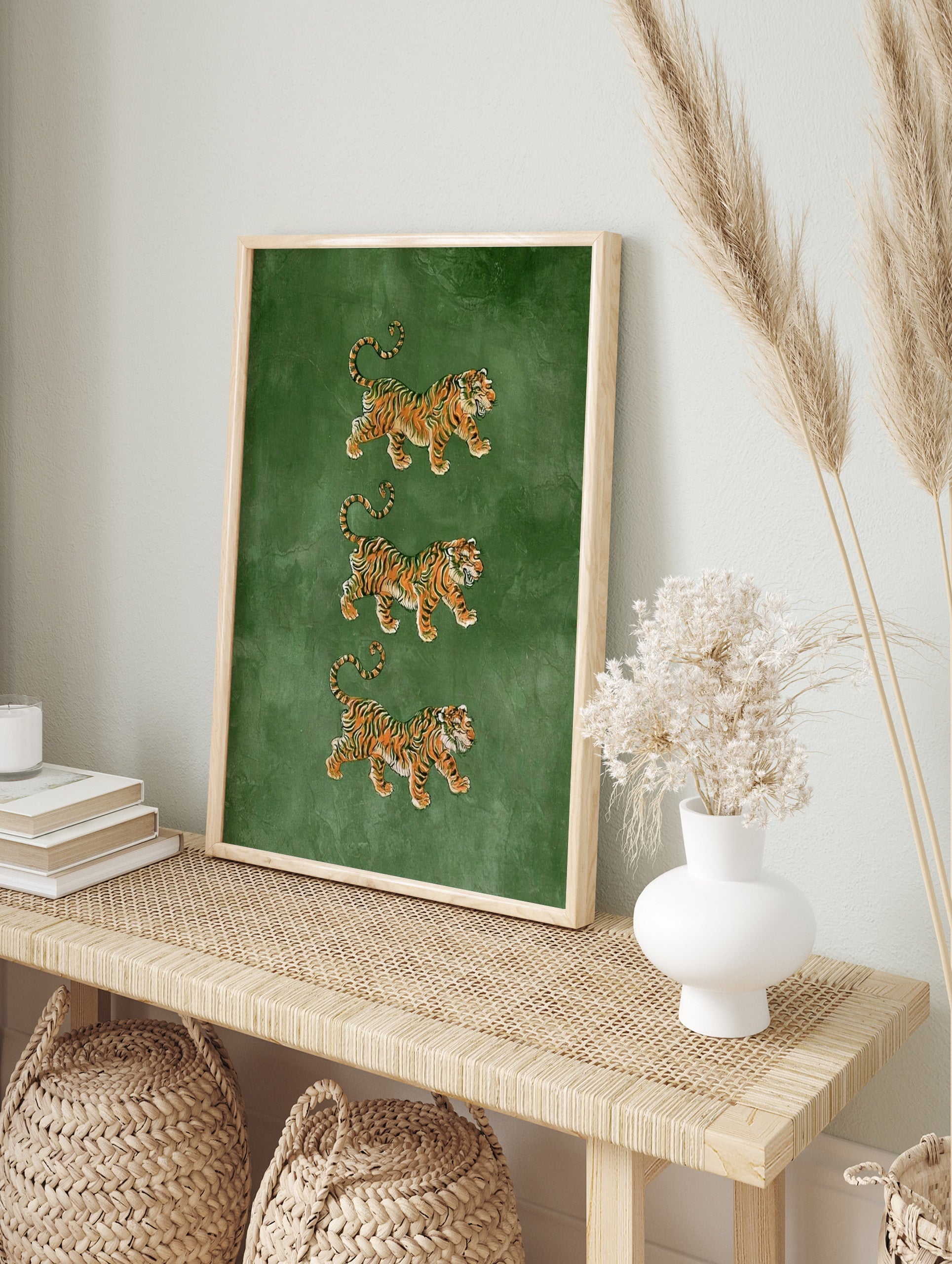 Three stacked tiger illustrations in orange and black on a textured green background, in an alternate framed mockup