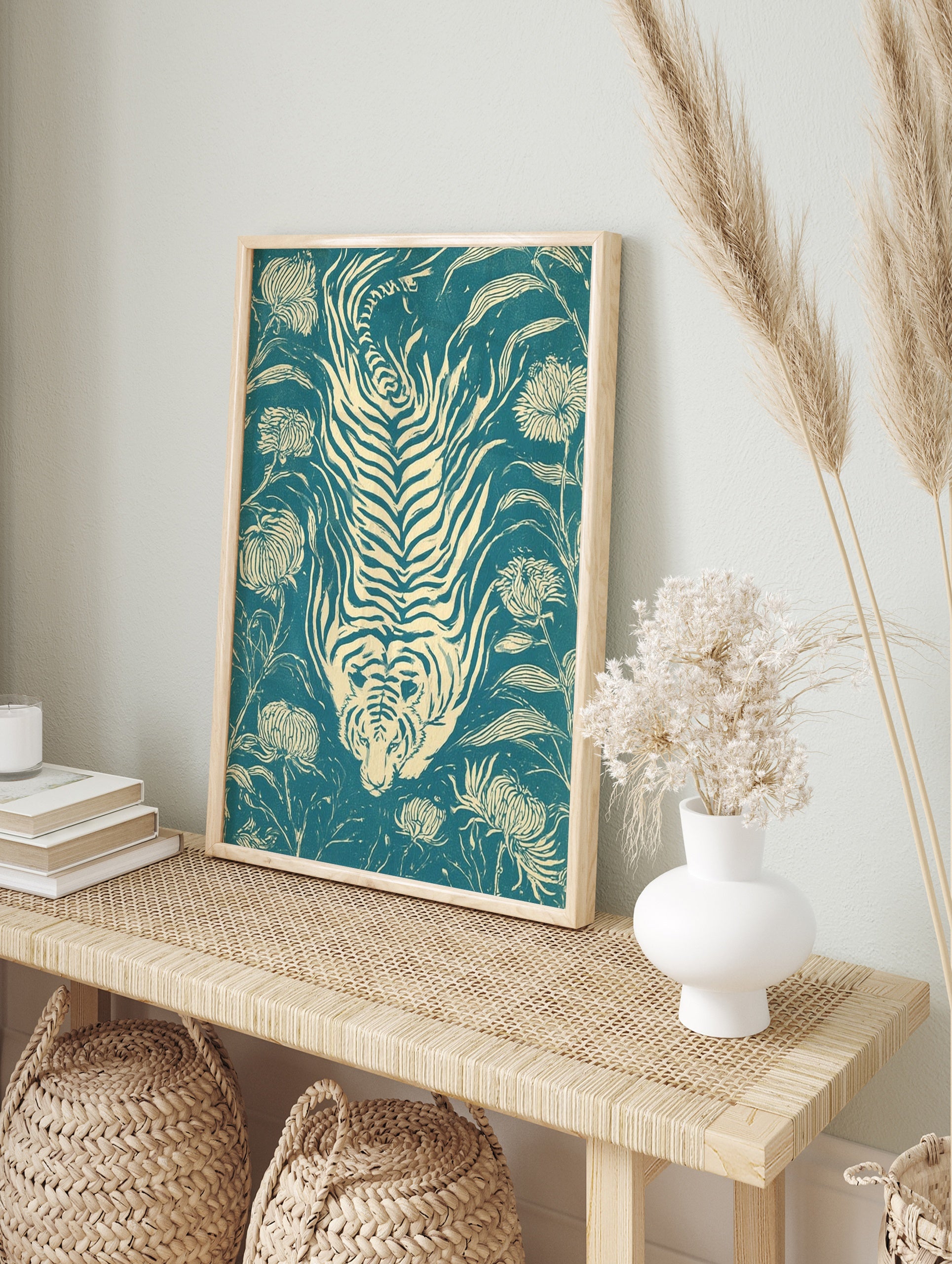 Stylized tiger and chrysanthemum flower illustration on teal background in a woodcut print, in an alternate framed mockup