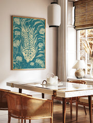 Stylized tiger and chrysanthemum flower illustration on teal background in a woodcut print style, in a styled room mockup