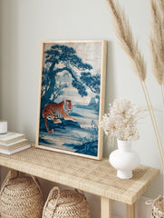 Japanese indigo art poster featuring an orange and black striped tiger lying by a blue lake with a large pine tree. - Image 4