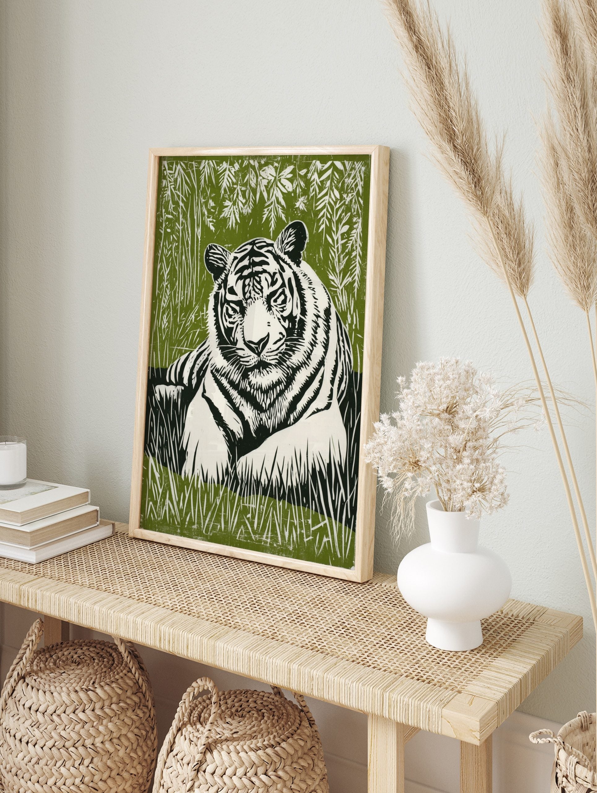 White tiger with black stripes resting in green jungle foliage, lino print style wall art, in an alternate framed mockup