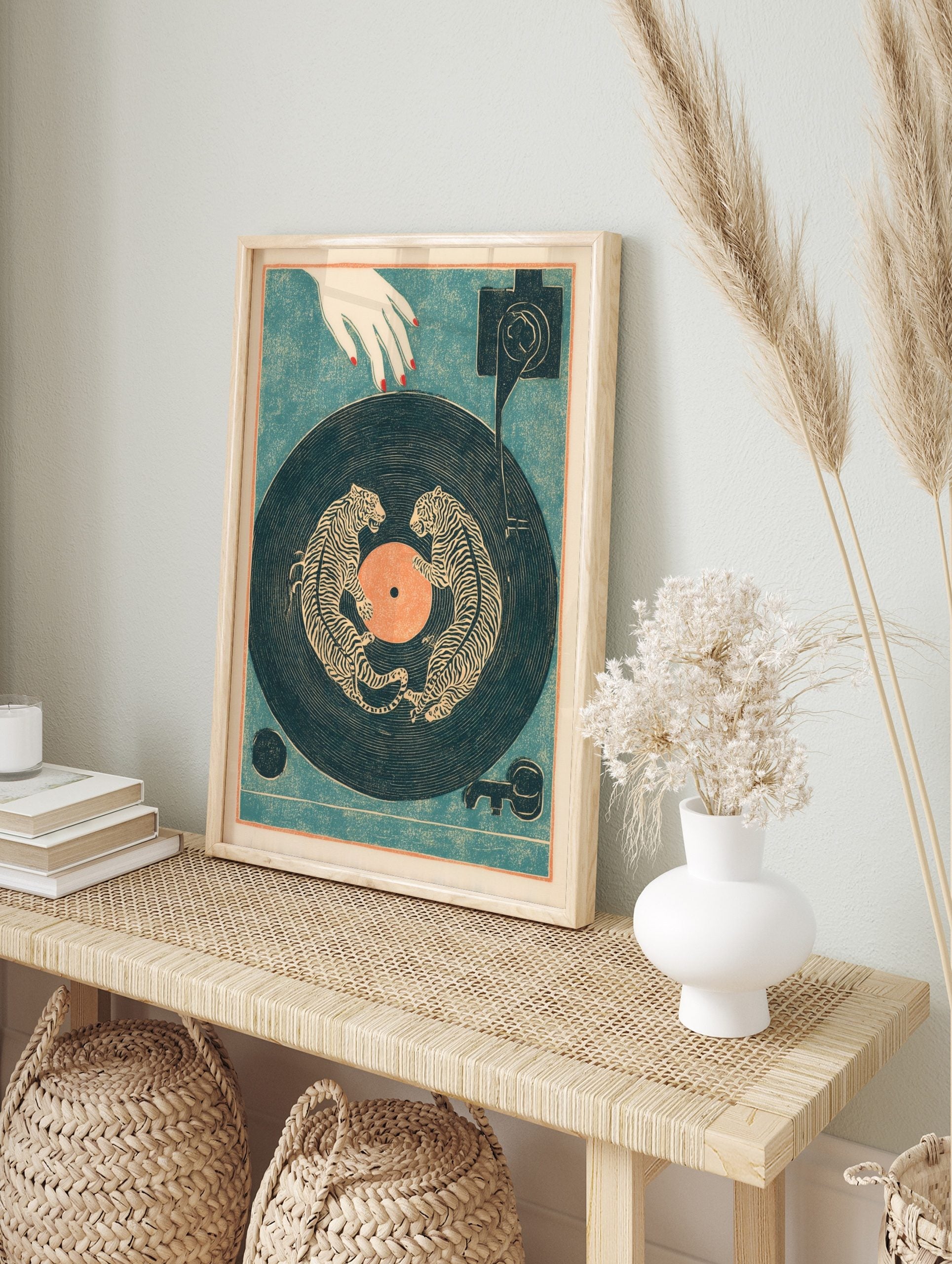 Illustrative tiger wall art print with two striped tigers on a dark blue vinyl record, with a, in an alternate framed mockup