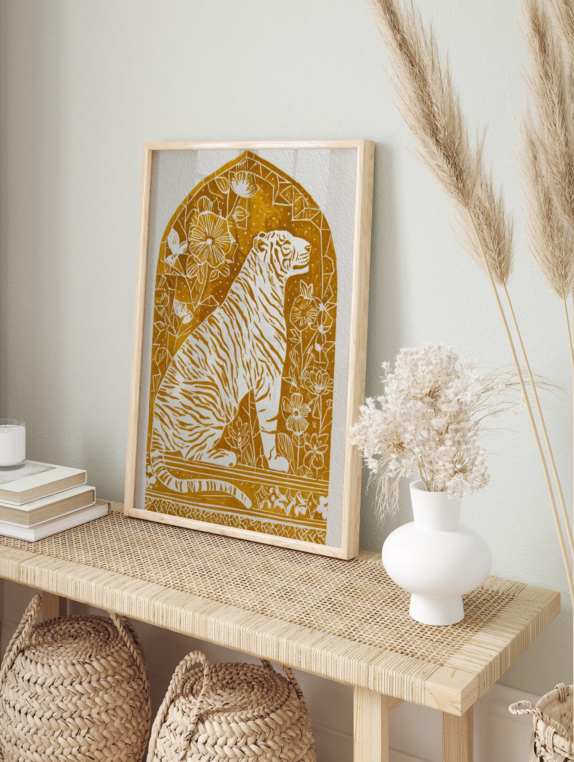 Illustrative golden tiger art print with white stripes and botanical details within an arched, in an alternate framed mockup