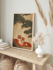 Two orange and black striped tigers resting under a dark green pine tree, depicted in a traditional Asian art style. Tiger wall art. - Image 3