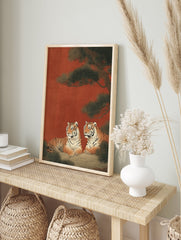 Two majestic tigers resting under a green pine tree against a reddish-brown background in a traditional Japanese tiger wall art print. - Image 3