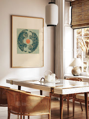 Illustrative print with two blue tigers in a circular yin-yang composition around an orange circle, in a styled room mockup