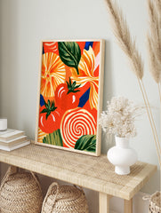 Illustrative food art print featuring tomatoes, basil, and pasta shapes on a vibrant orange, in an alternate framed mockup