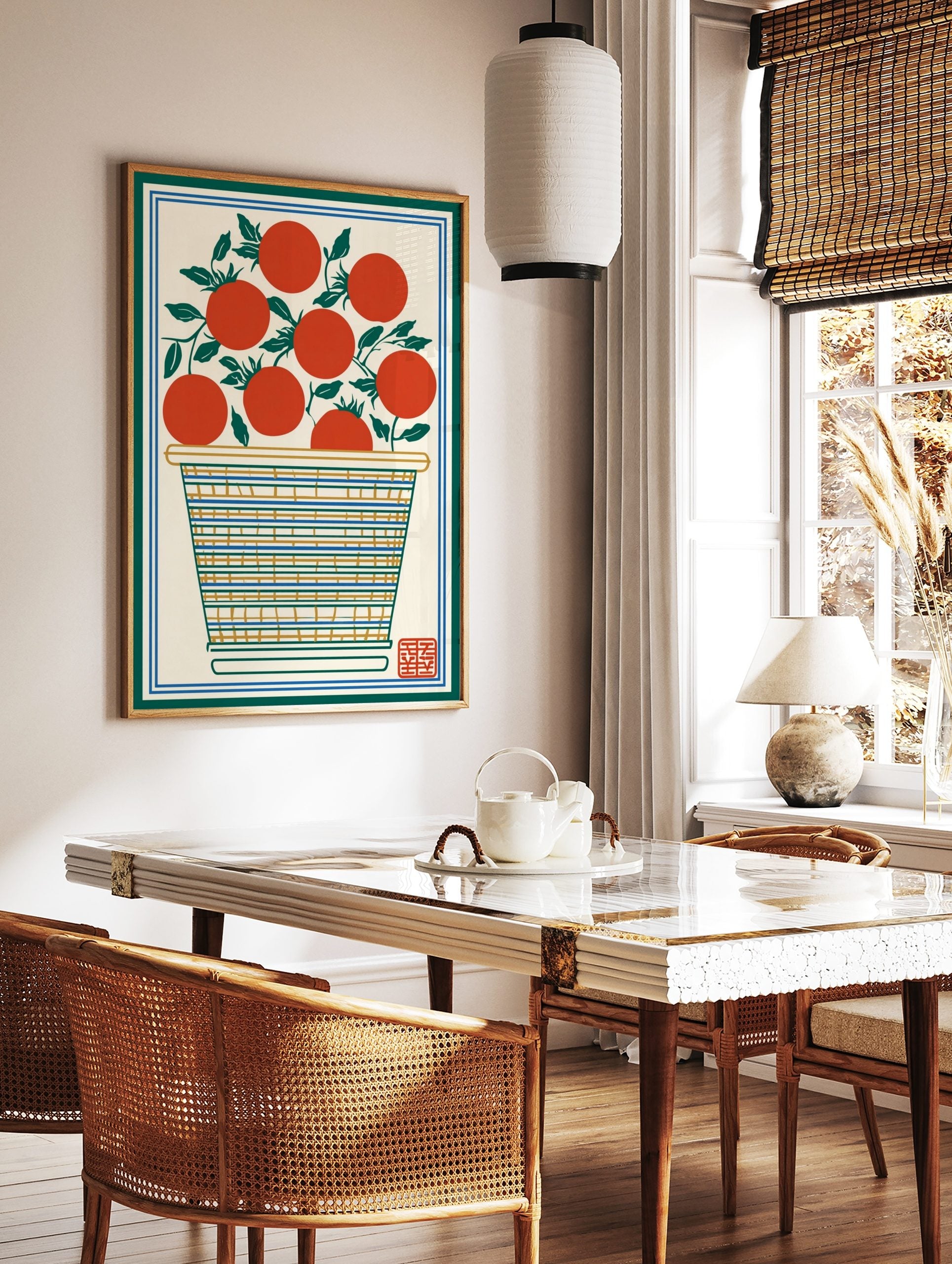 Illustrative print of red tomatoes with green leaves in a striped basket, framed by green and blue, in a styled room mockup