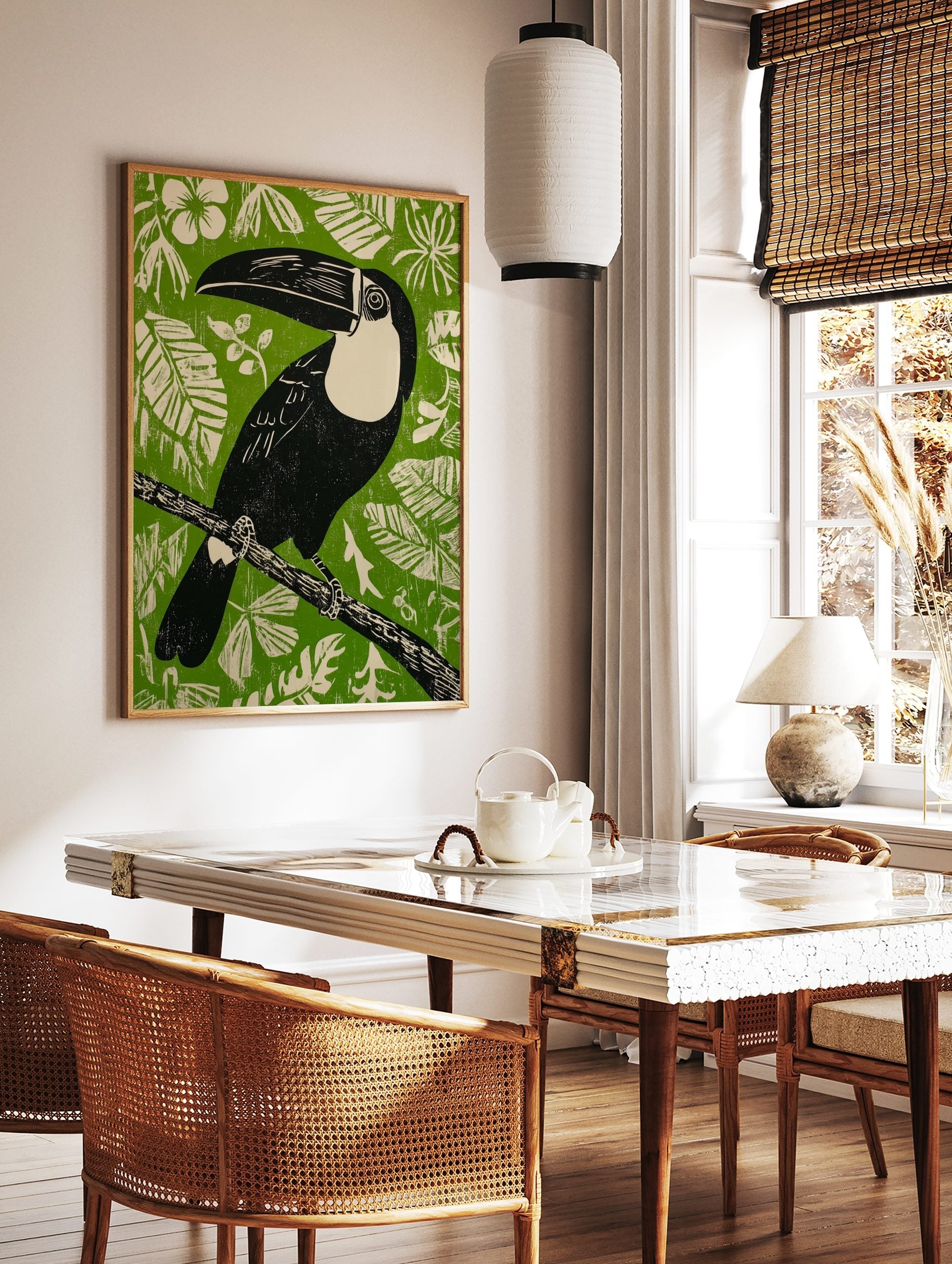 Illustrative black toucan with cream chest and large beak on branch against green background with, in a styled room mockup