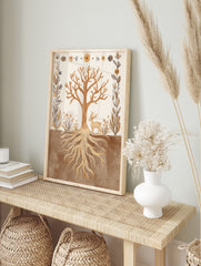 Illustrative art print of a tree with roots, deer, and botanical border in earth tones, in an alternate framed mockup