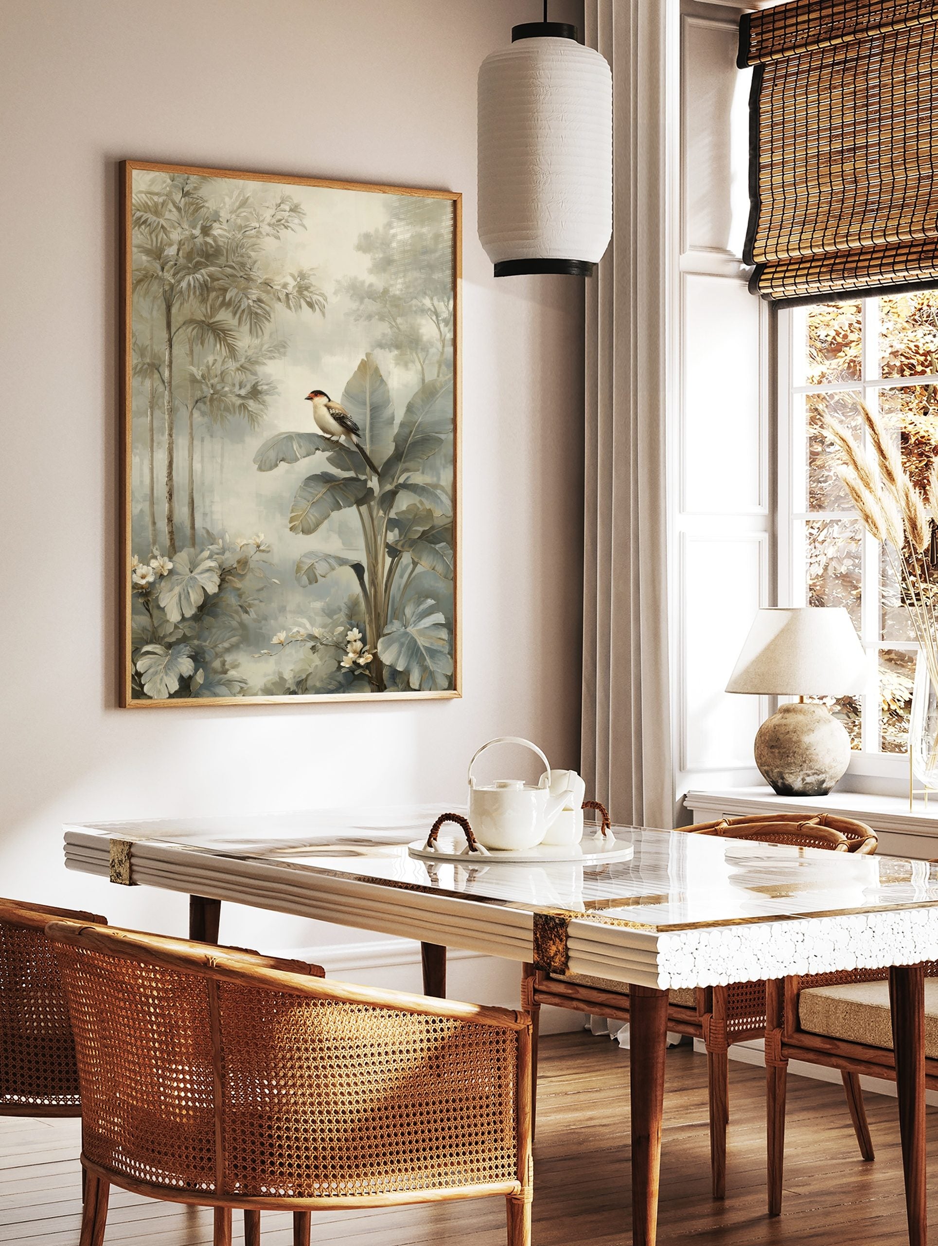 Tropical bird with red head perched on large banana leaf in muted jungle foliage art print, in a styled room mockup