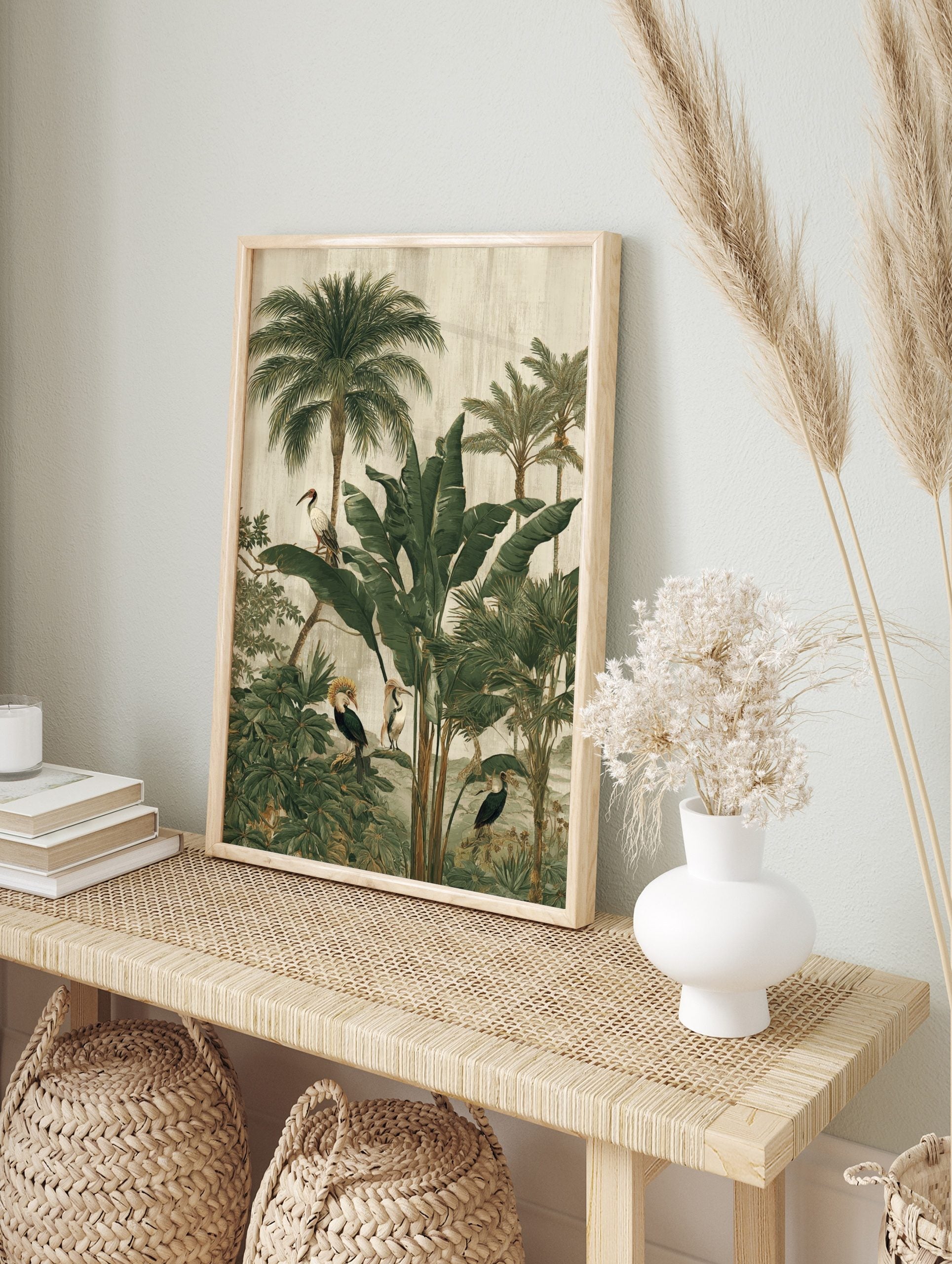 Illustrative jungle scene with tropical birds, palm trees, and large green leaves on a, in an alternate framed mockup