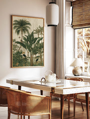 Illustrative jungle scene with tropical birds, palm trees, and large green leaves on a textured, in a styled room mockup