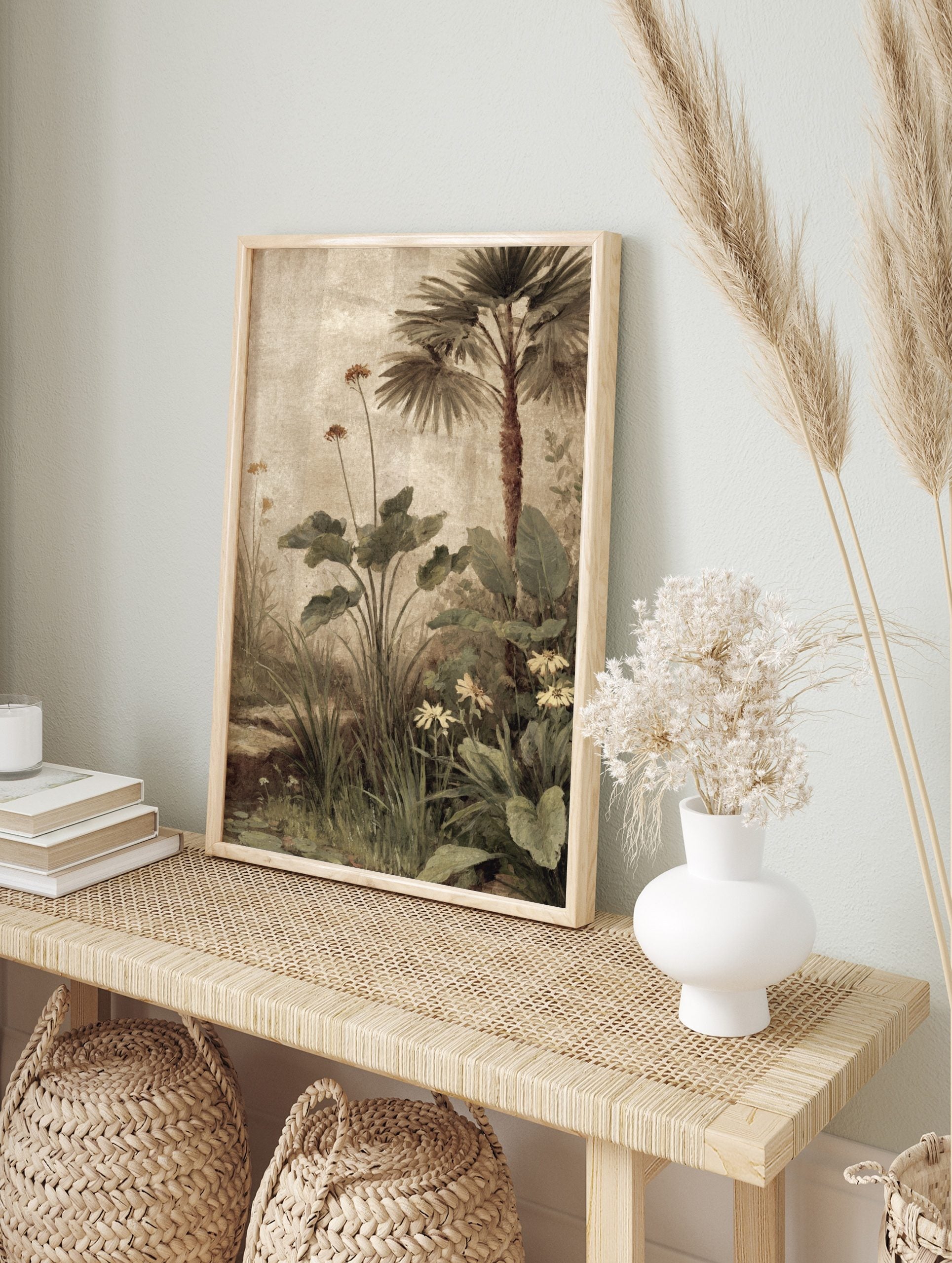 Vintage tropical botanical illustration with palm tree, large green leaves, and reddish-brown, in an alternate framed mockup