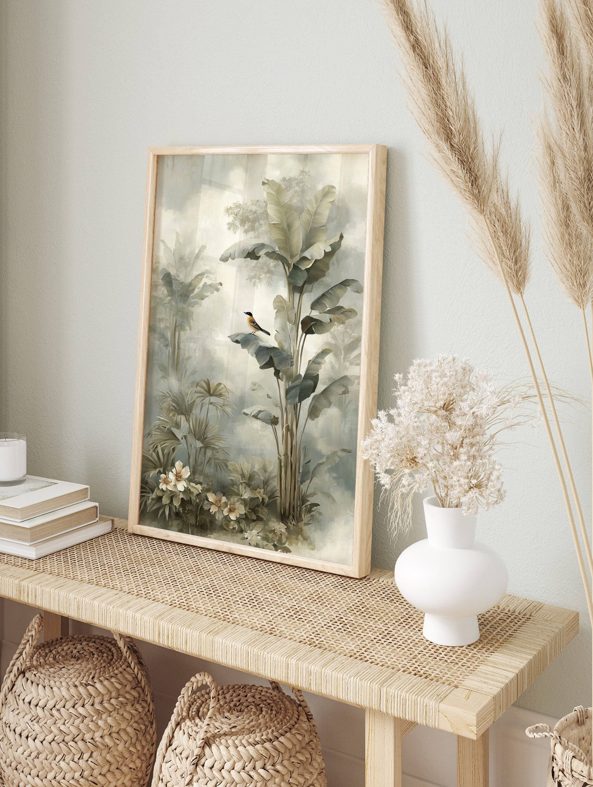 Illustrative tropical jungle print with a small bird on a banana leaf, palm plants, and white, in an alternate framed mockup