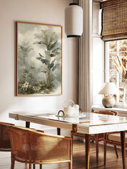 Illustrative tropical jungle print with a small bird on a banana leaf, palm plants, and white, in a styled room mockup