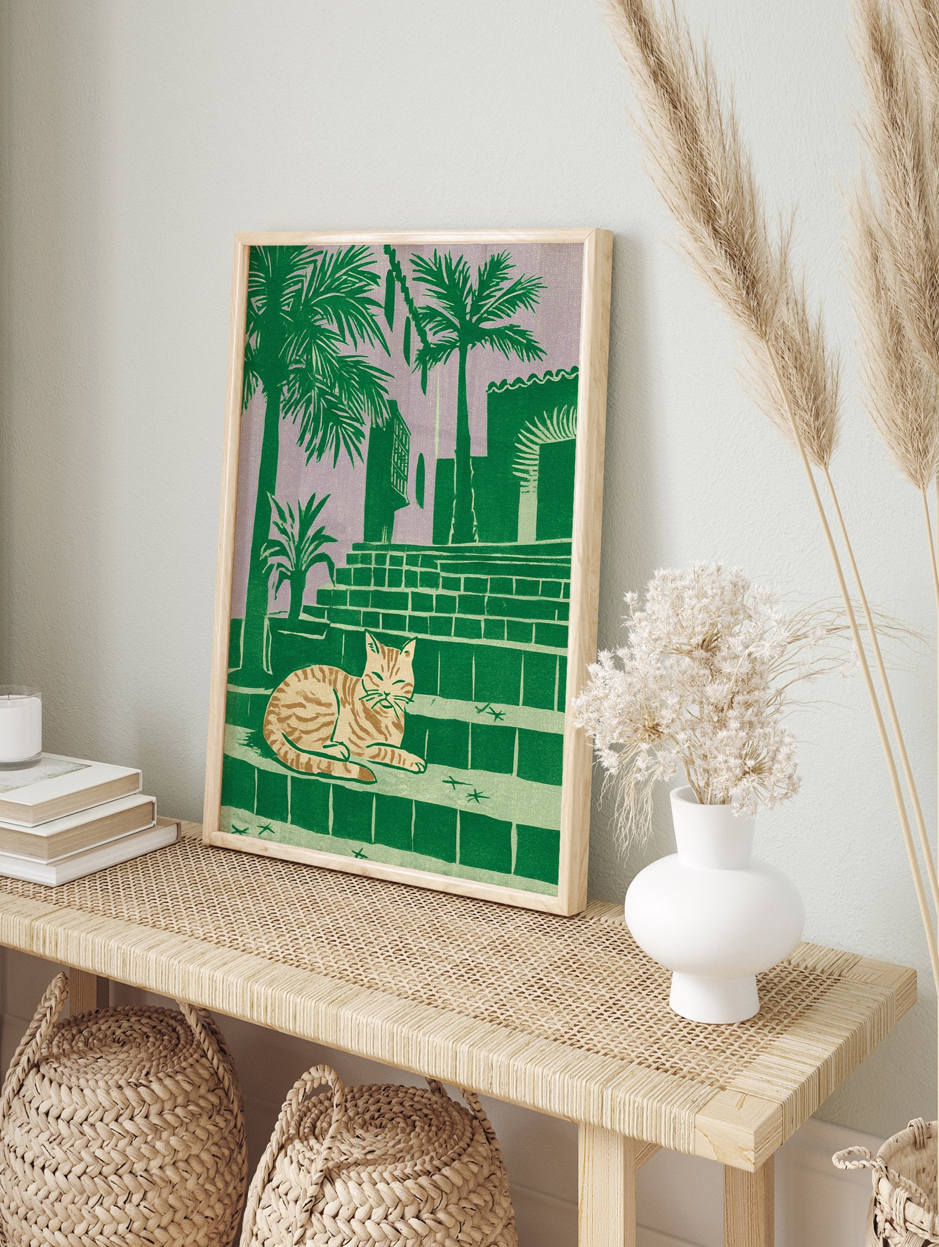 Tropical cat print of a striped feline resting on steps with palm trees and a building against a purple sky. - Image 3