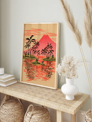 Illustrative tropical island landscape print with red volcano, black palm trees on green, in an alternate framed mockup