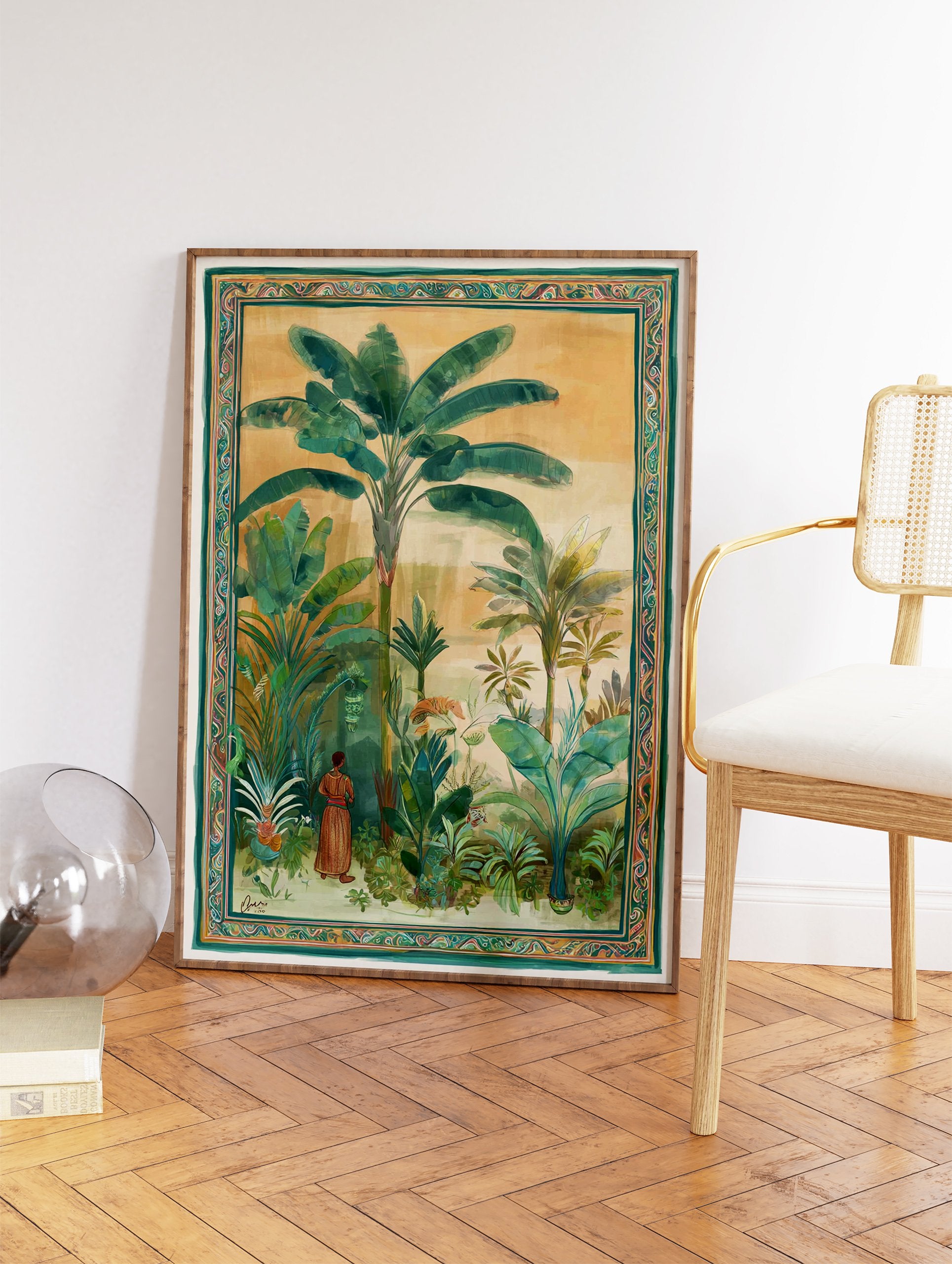 Illustrated tropical jungle wall art with banana trees, lush green foliage, and a person in traditional attire, framed with an intricate border. - Image 2