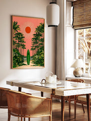Green surfboard on sandy path, framed by palm trees under coral pink sky with orange sun, tropical, in a styled room mockup