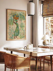 Tropical Woman Wall Art featuring a woman carrying a basket of fruit on her head, surrounded by lush green palm leaves. - Image 3