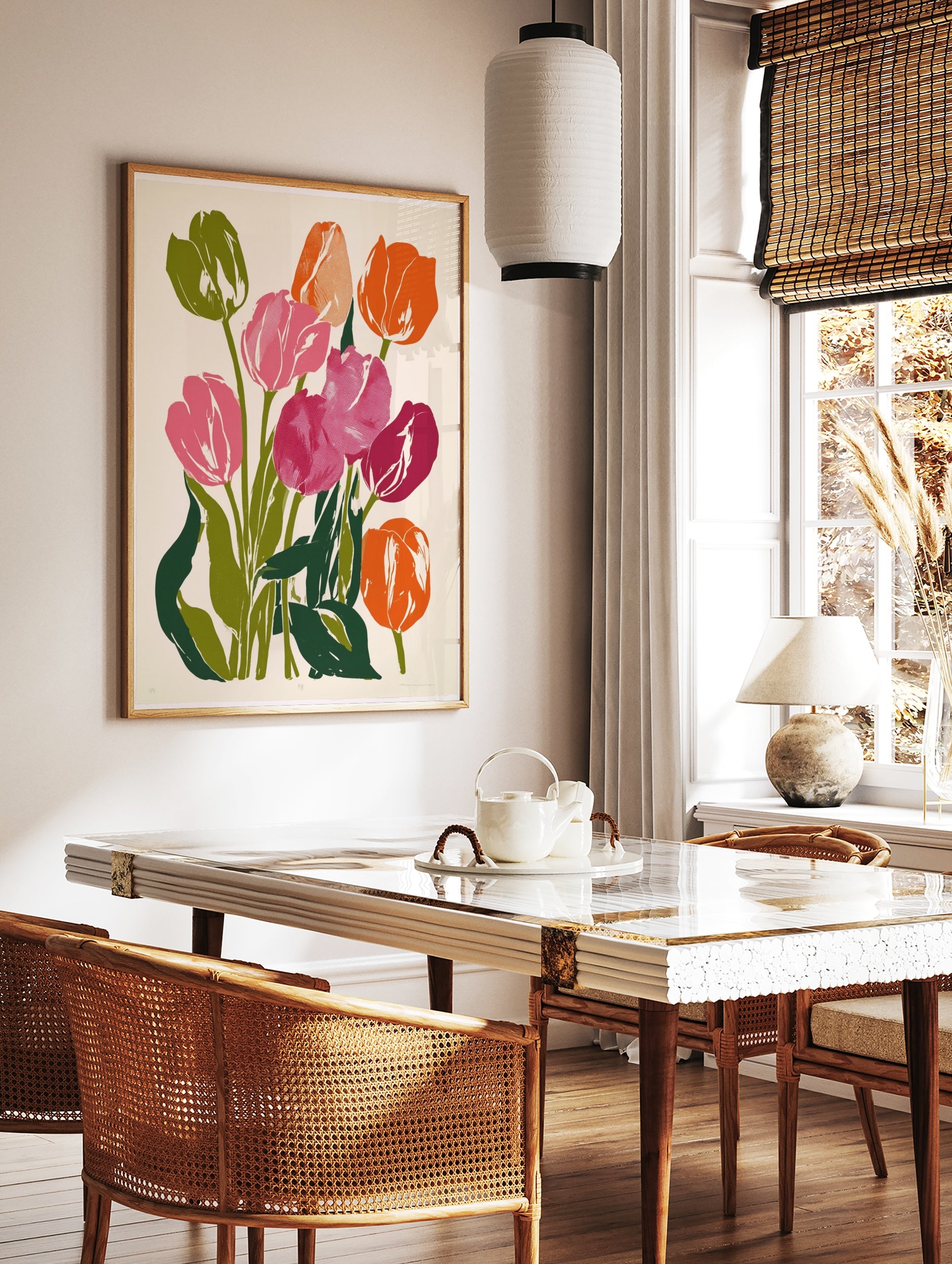 Vibrant tulip flower botanical art print with pink and orange petals and green leaves on a light, in a styled room mockup