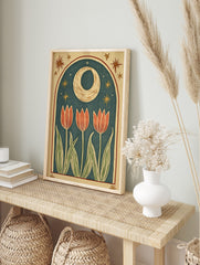 Illustrative print of three pink tulip flowers with green leaves under a golden crescent moon, in an alternate framed mockup