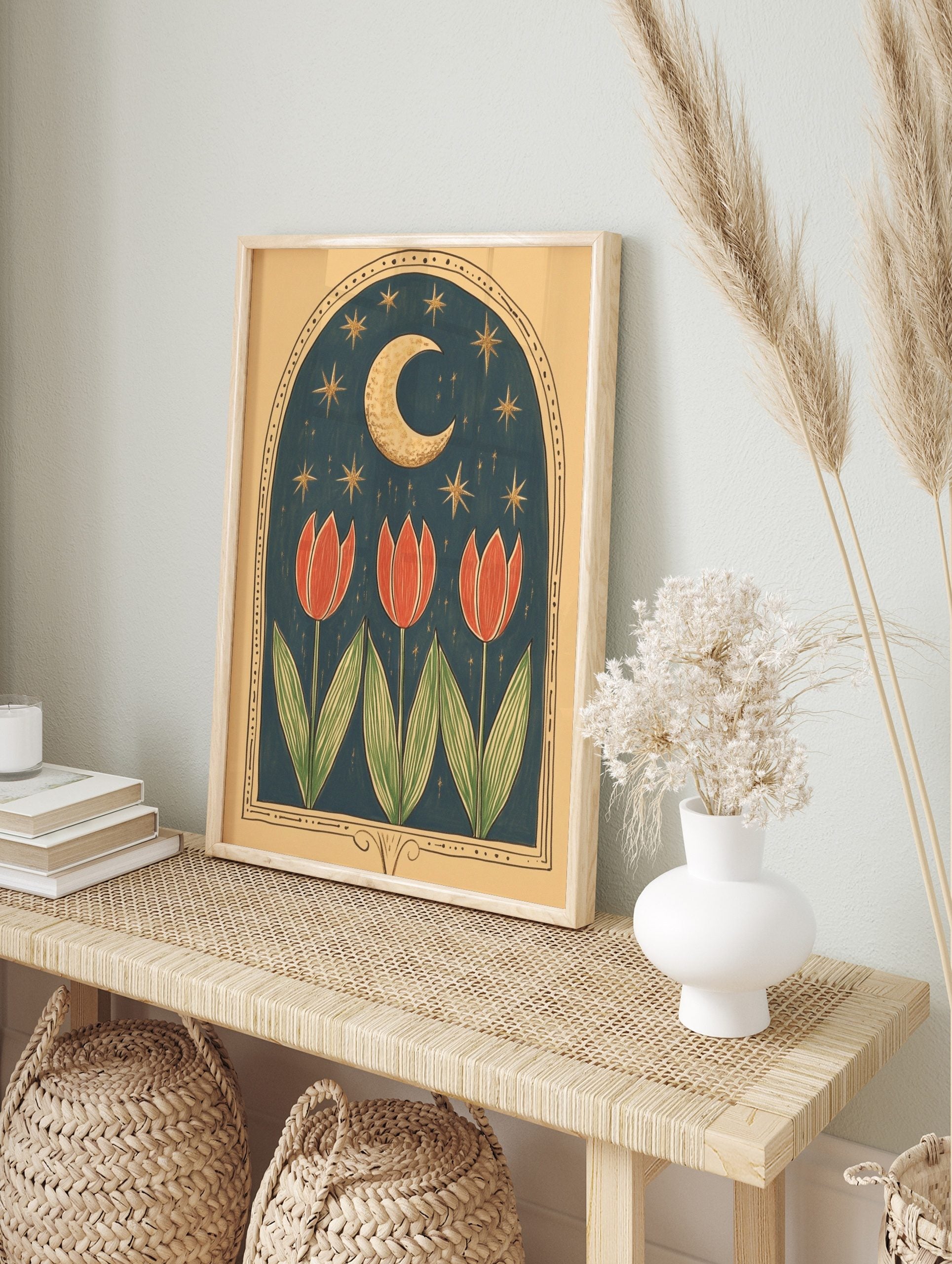 Illustrative art print with three red tulips under a golden crescent moon and stars in a dark, in an alternate framed mockup