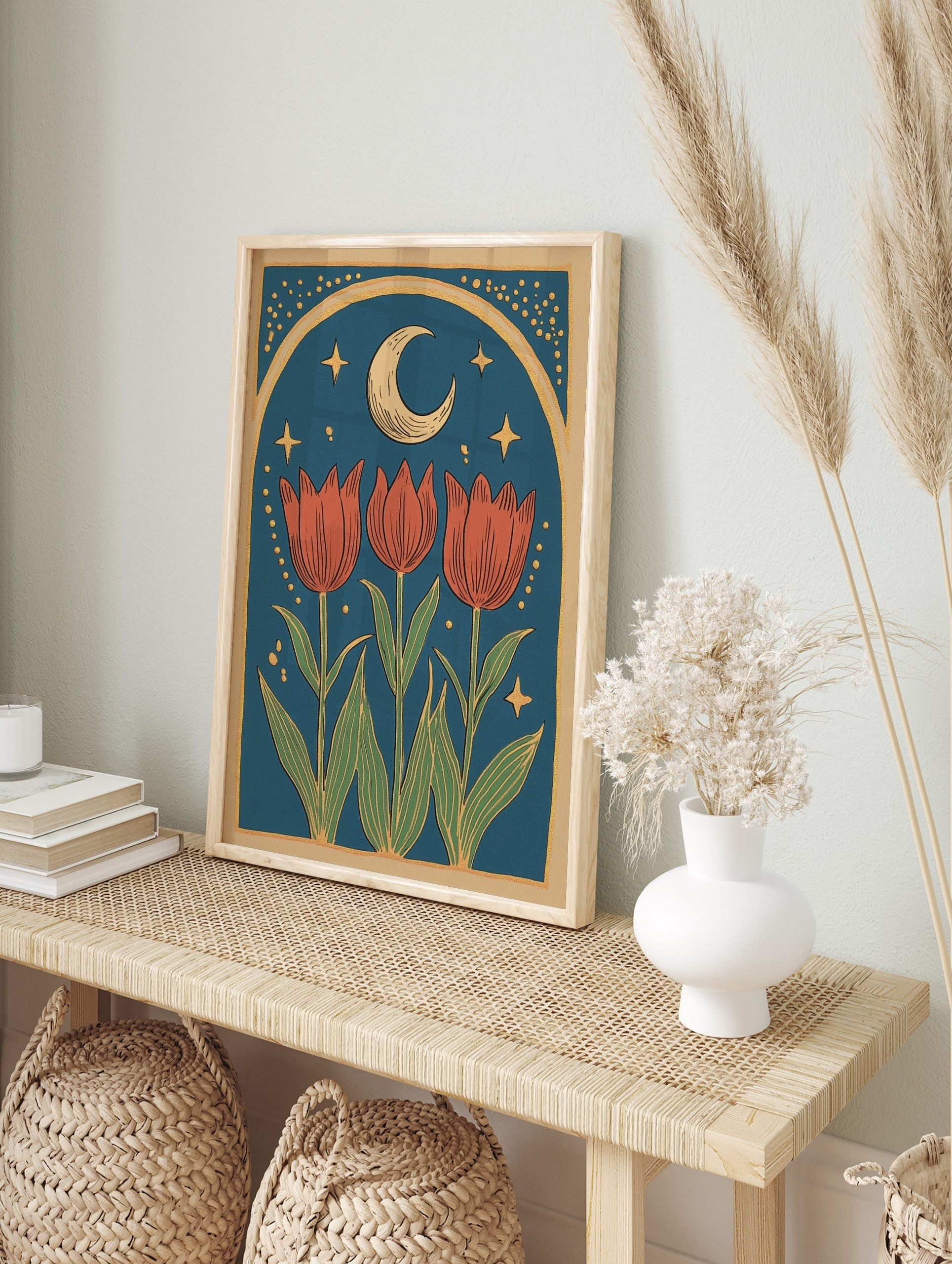 Illustrative print with three red tulips, green leaves, crescent moon, golden stars, and, in an alternate framed mockup