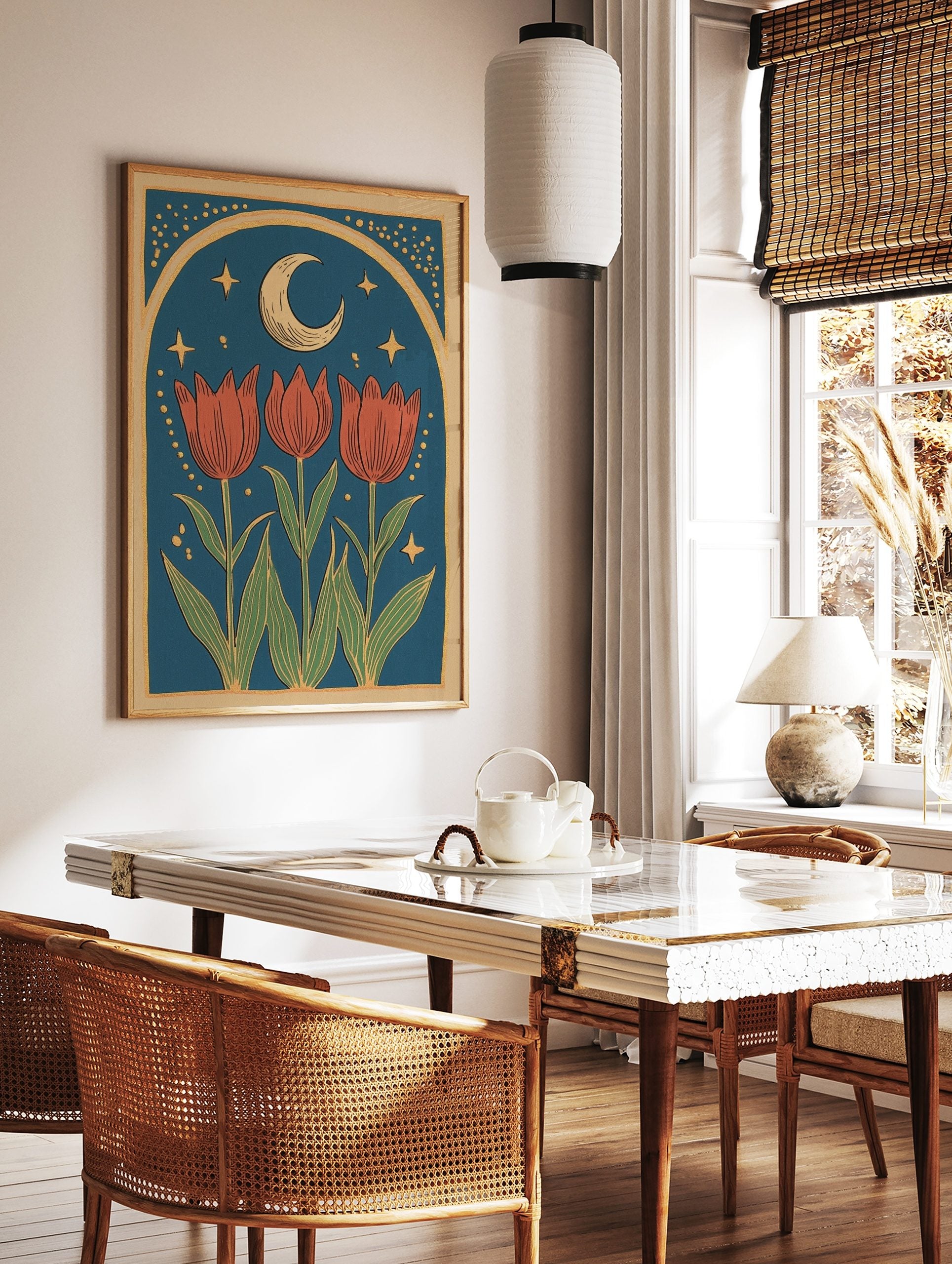 Illustrative print with three red tulips, green leaves, crescent moon, golden stars, and arched, in a styled room mockup