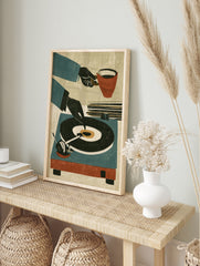 Retro illustration of a hand placing a vinyl record on a turntable, with a coffee cup, in, in an alternate framed mockup
