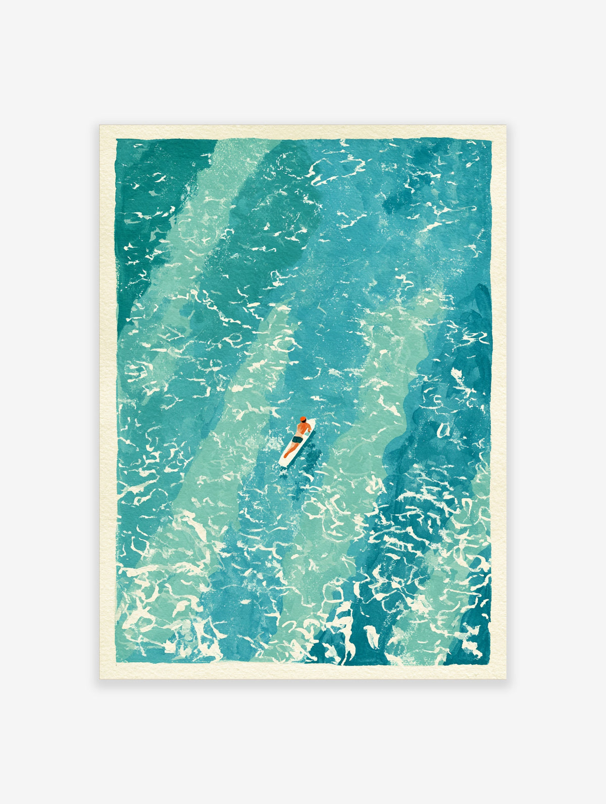 Aerial view of a surfer paddling a white surfboard on turquoise ocean water with white foam