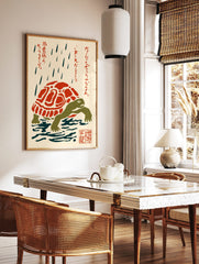 Japanese folk art print of a green turtle with a red and white shell in the rain, with red kanji, in a styled room mockup