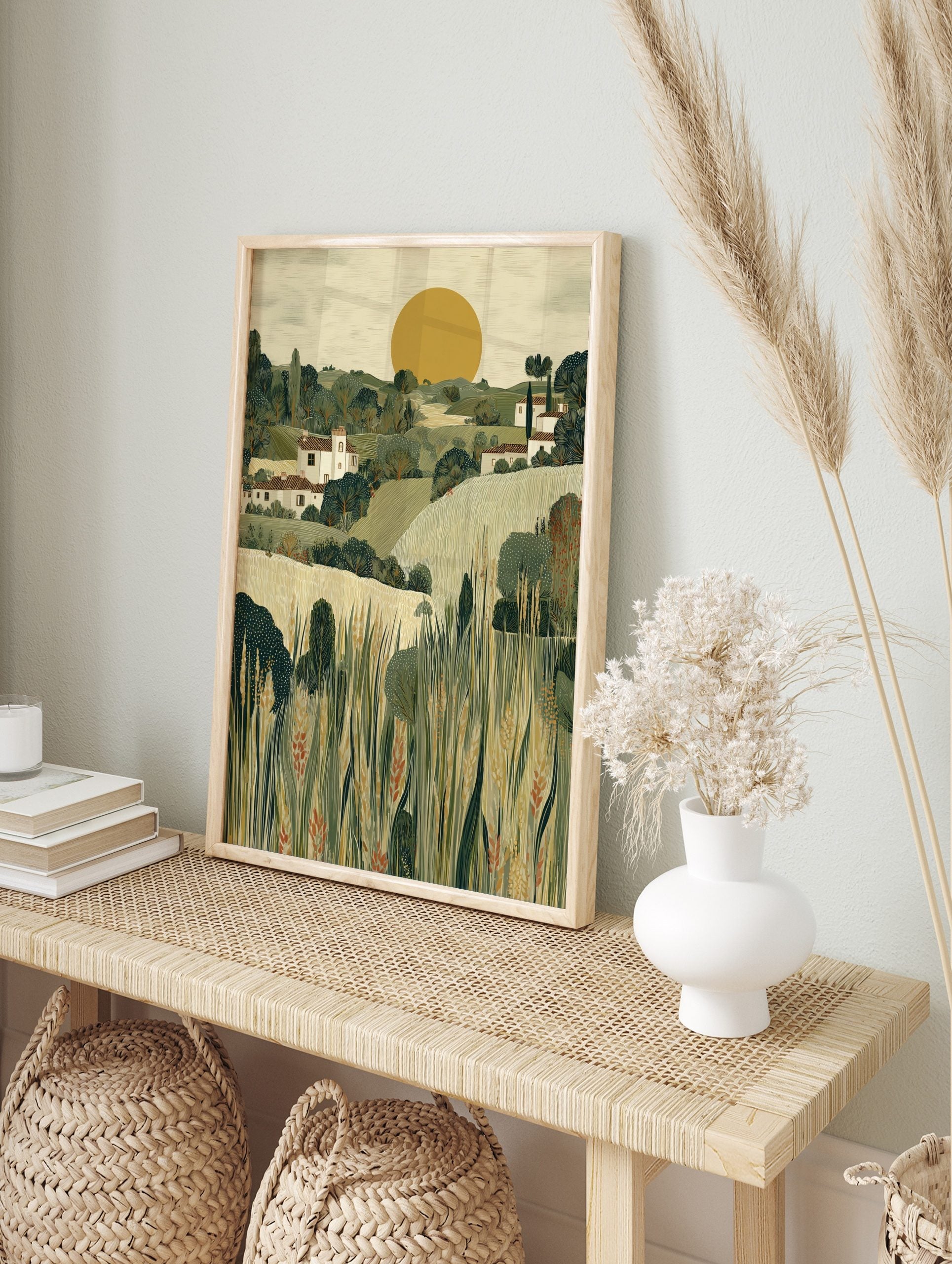 Illustrative Tuscan landscape art print with white houses, green hills, golden wheat fields, in an alternate framed mockup