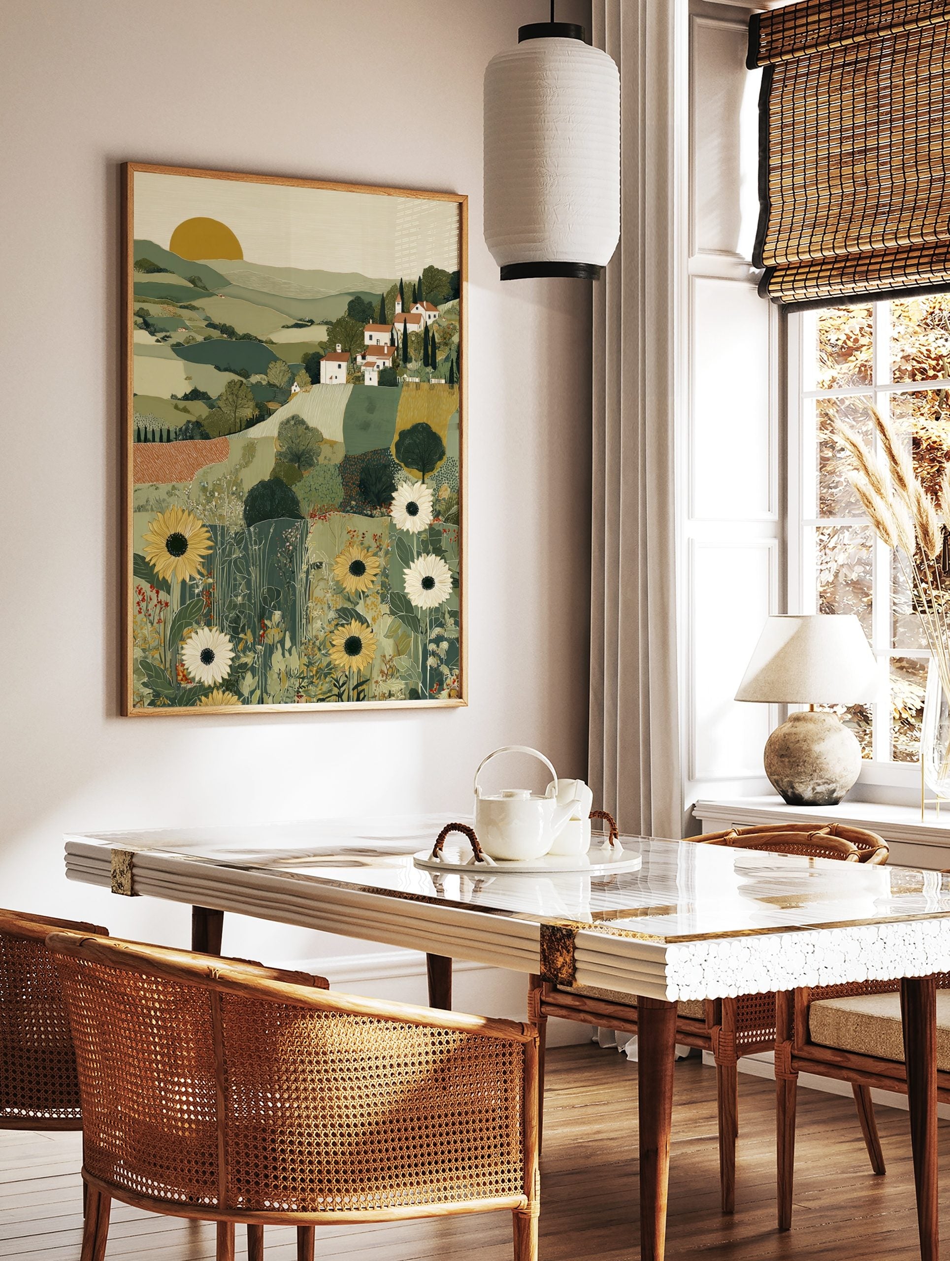 Illustrative Tuscan landscape art print with green hills, white village houses, cypress trees, and, in a styled room mockup