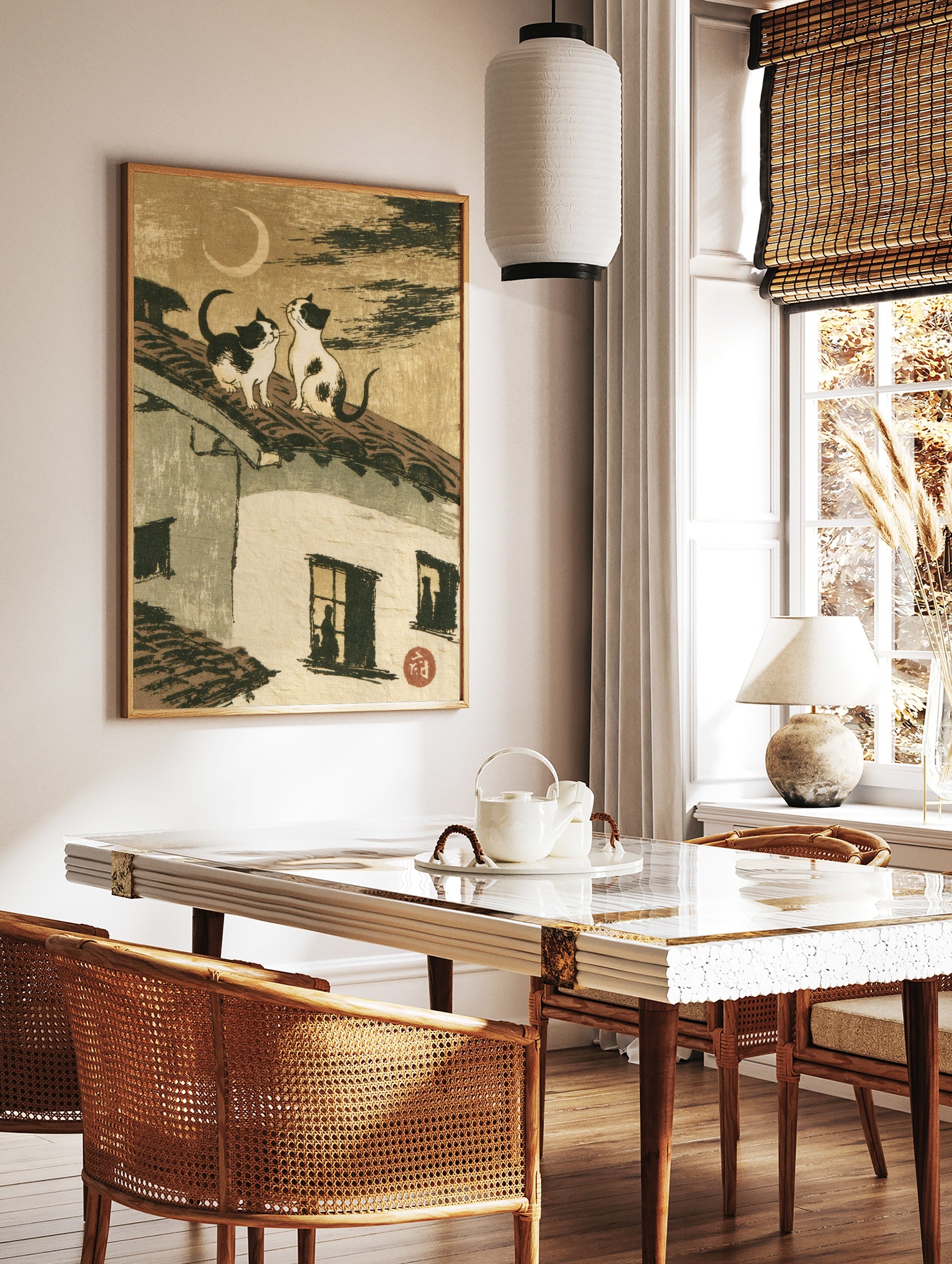 Two cats sitting on a tiled roof looking at a crescent moon, Japanese style illustration art print, in a styled room mockup