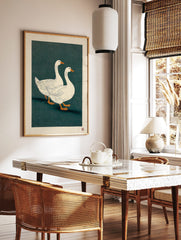 Two white geese with orange beaks walking on a dark teal background in a Japanese illustrative art, in a styled room mockup