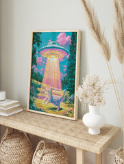 Surreal art print of a tabby cat being abducted by a glowing UFO in a vibrant, retro-styled, in an alternate framed mockup