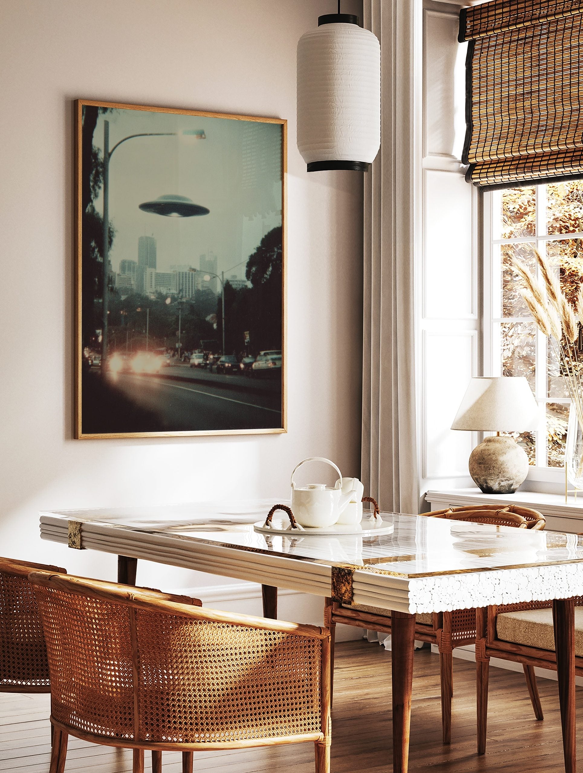 Retro photographic print of a flying saucer hovering over a hazy city street with car headlights, in a styled room mockup