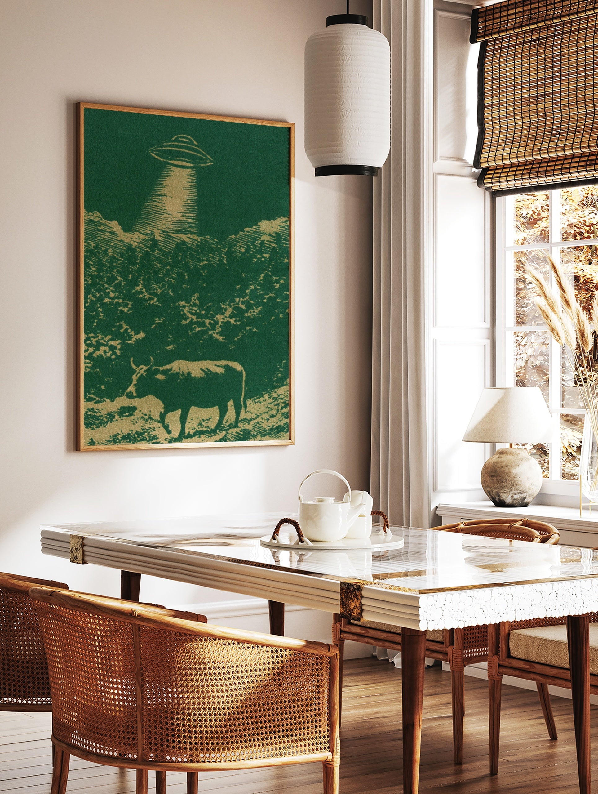 UFO hovering over a cow in a field illustration with green and gold colours, retro-futurist style, in a styled room mockup