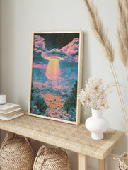 Psychedelic UFO desert landscape wall art print with vibrant pink and teal colours and a, in an alternate framed mockup