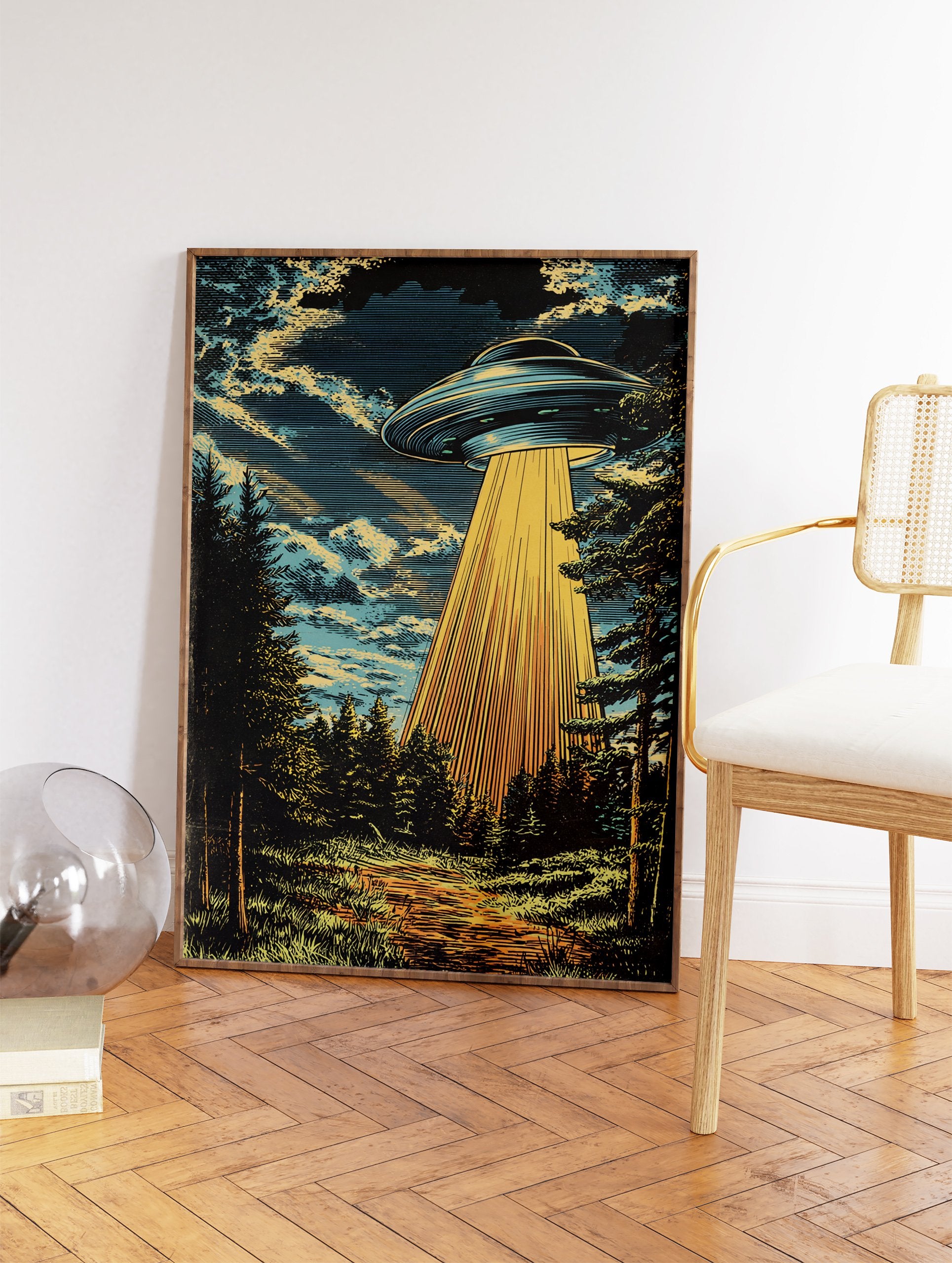 UFO Wall Art illustration showing a flying saucer hovering over a dark forest, emitting a strong golden light beam downwards. - Image 2