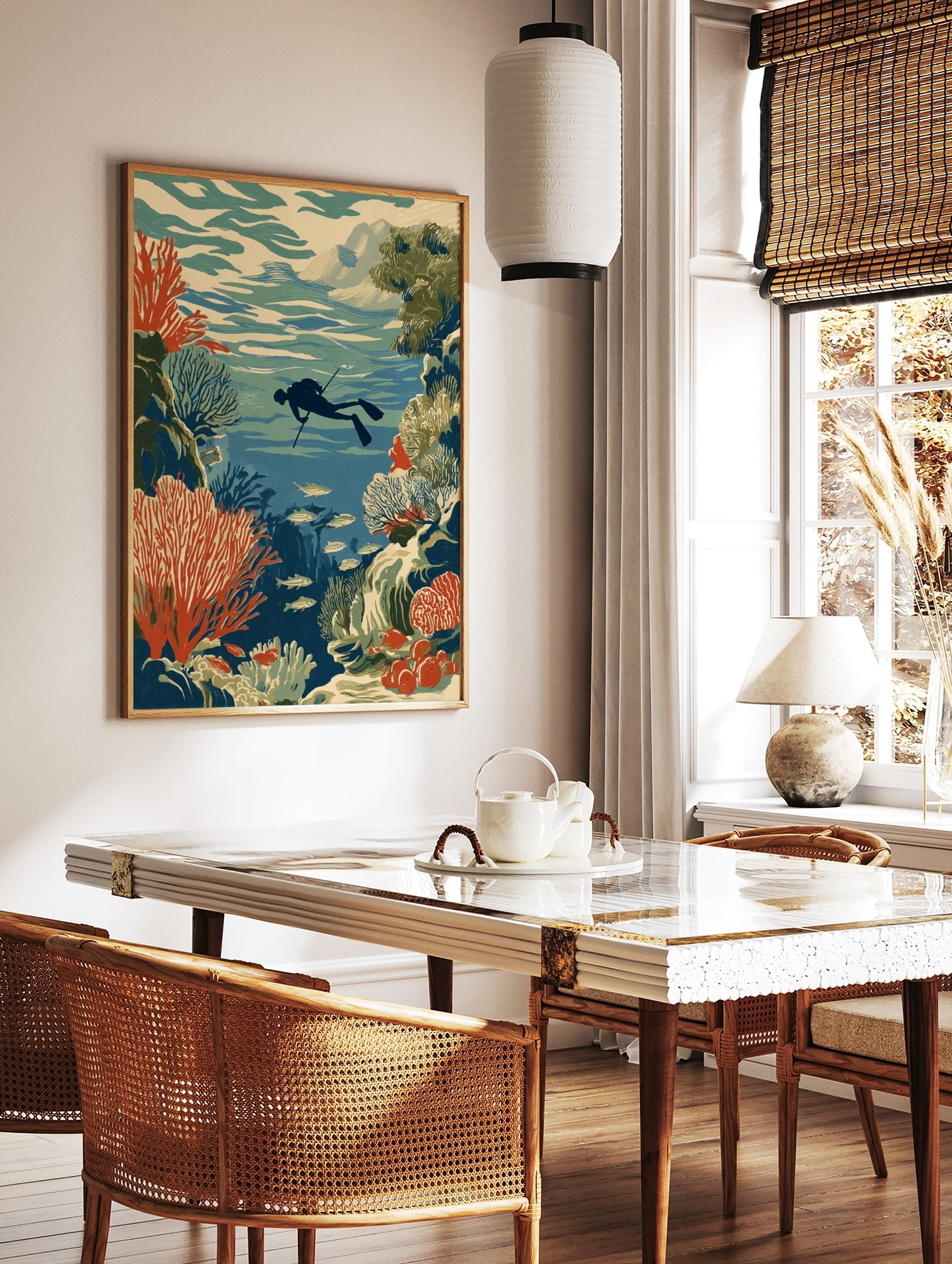 Underwater illustration of a diver with a spear, surrounded by red coral reefs and schools of fish, in a styled room mockup
