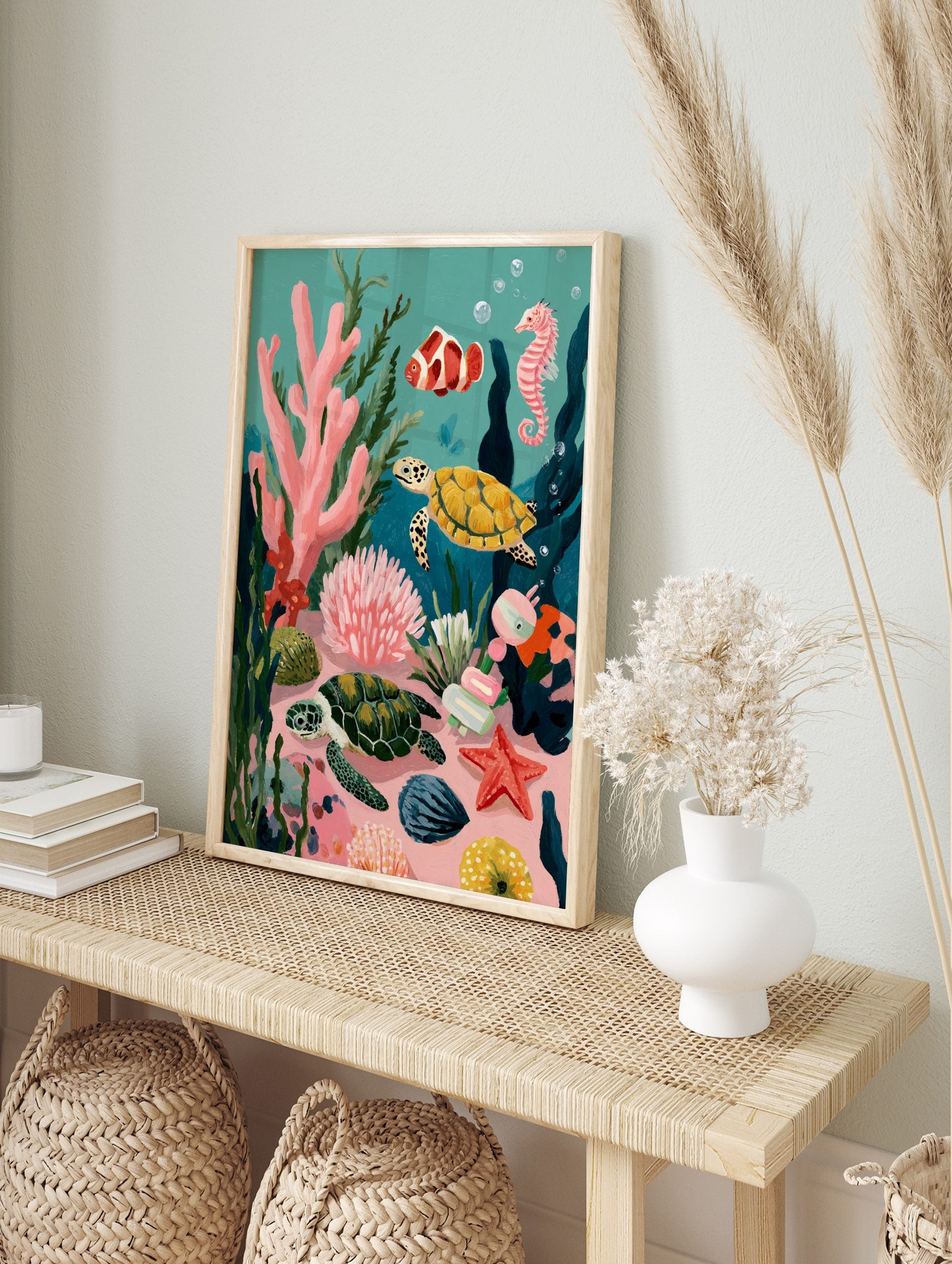 Illustrative underwater scene with two sea turtles, clownfish, seahorse, and colourful coral, in an alternate framed mockup