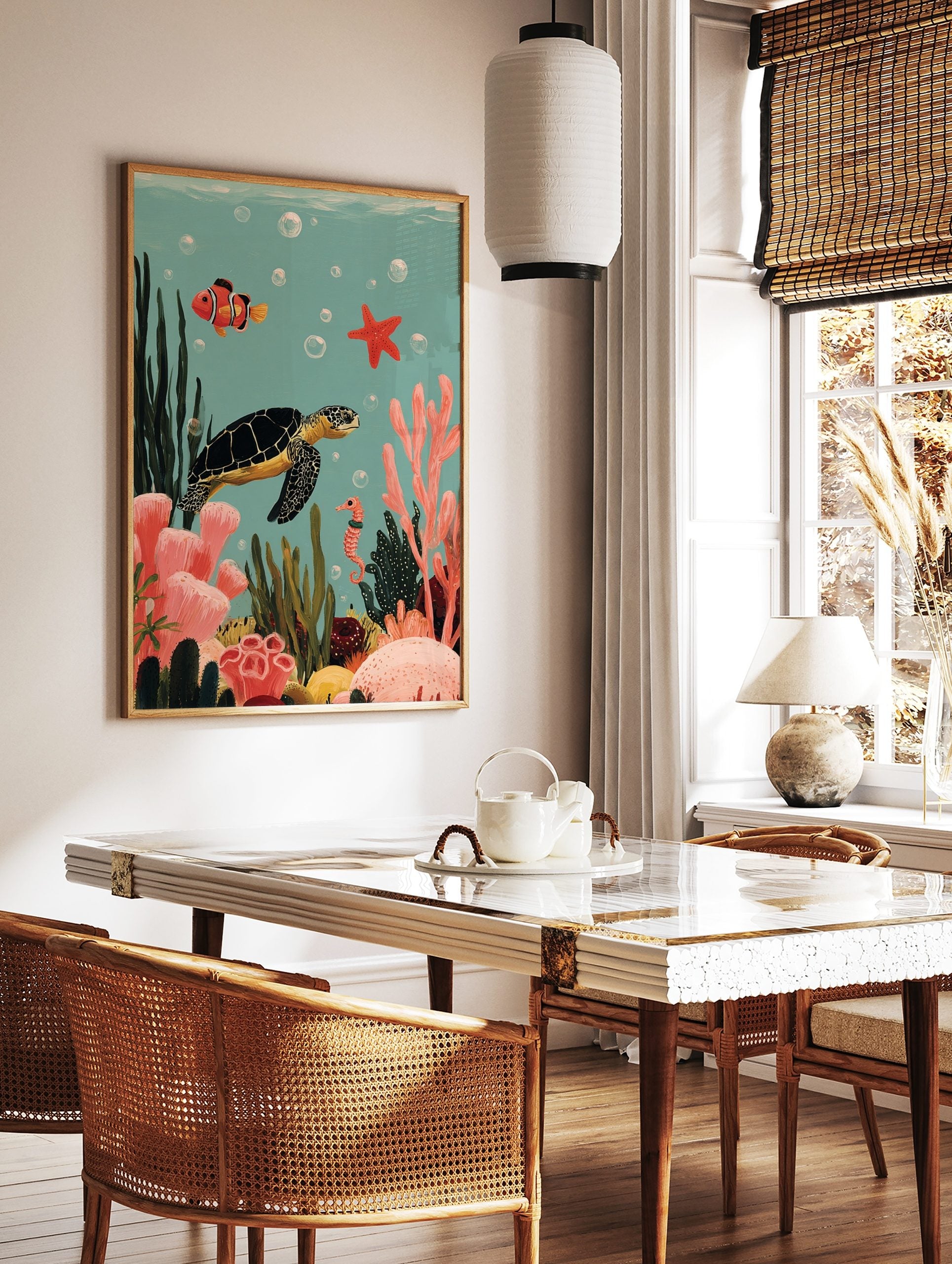 Colourful illustrative print of an underwater ocean scene with a sea turtle, clownfish, seahorse, in a styled room mockup