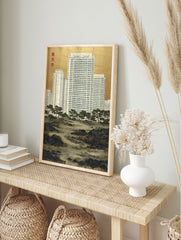 Urban Landscape Art print showing modern white high-rise buildings behind traditional Japanese pine trees and a rocky river, with a gold background. - Image 3