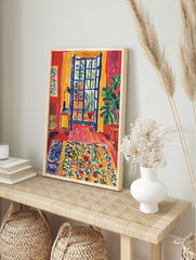 Vibrant interior room poster with a blue open window, green plants in pots, red walls, yellow curtains, and a colorful floral rug. - Image 4