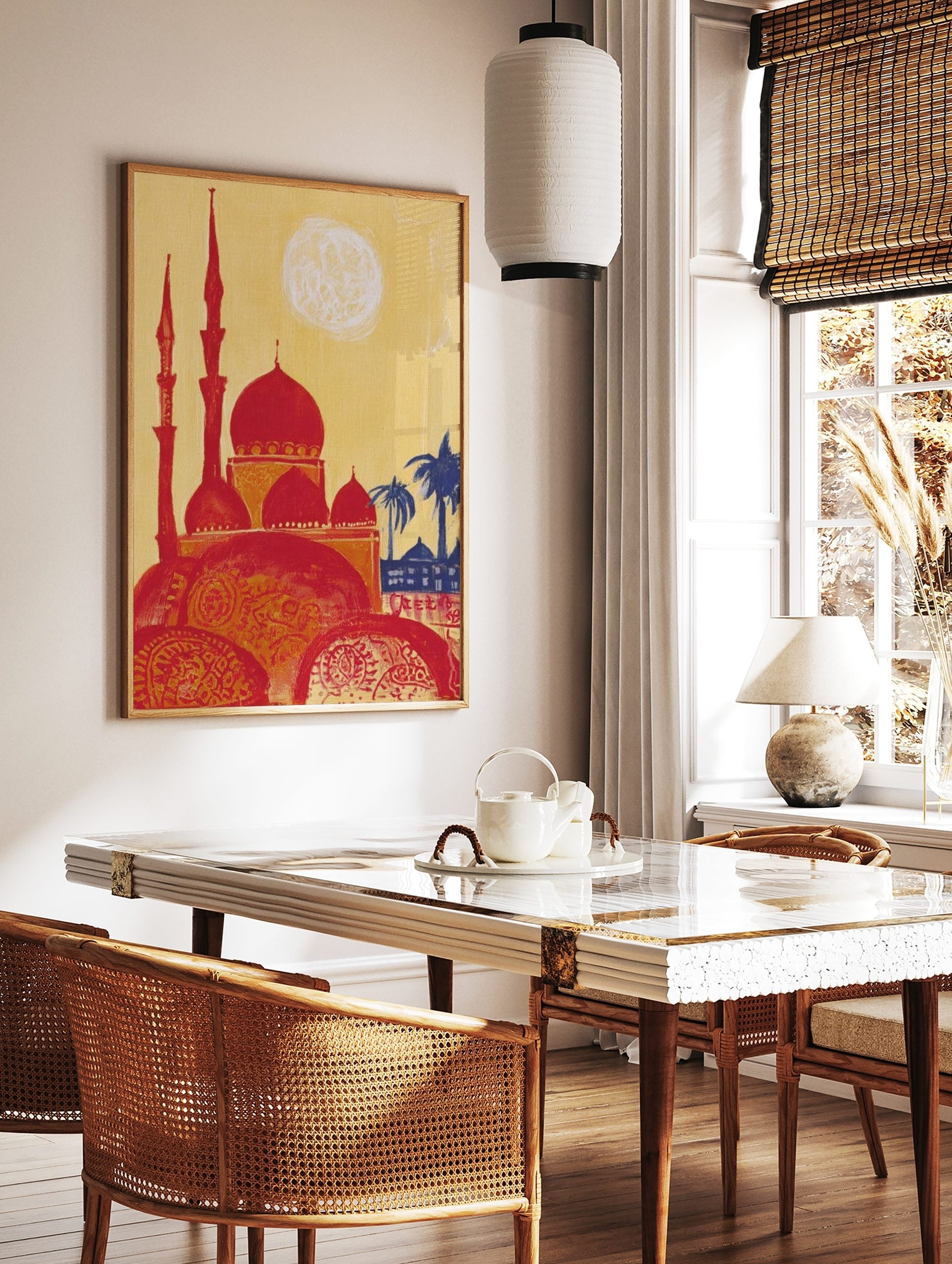 Illustrative print of a red mosque with multiple domes and minarets, yellow sky, blue palm trees, in a styled room mockup