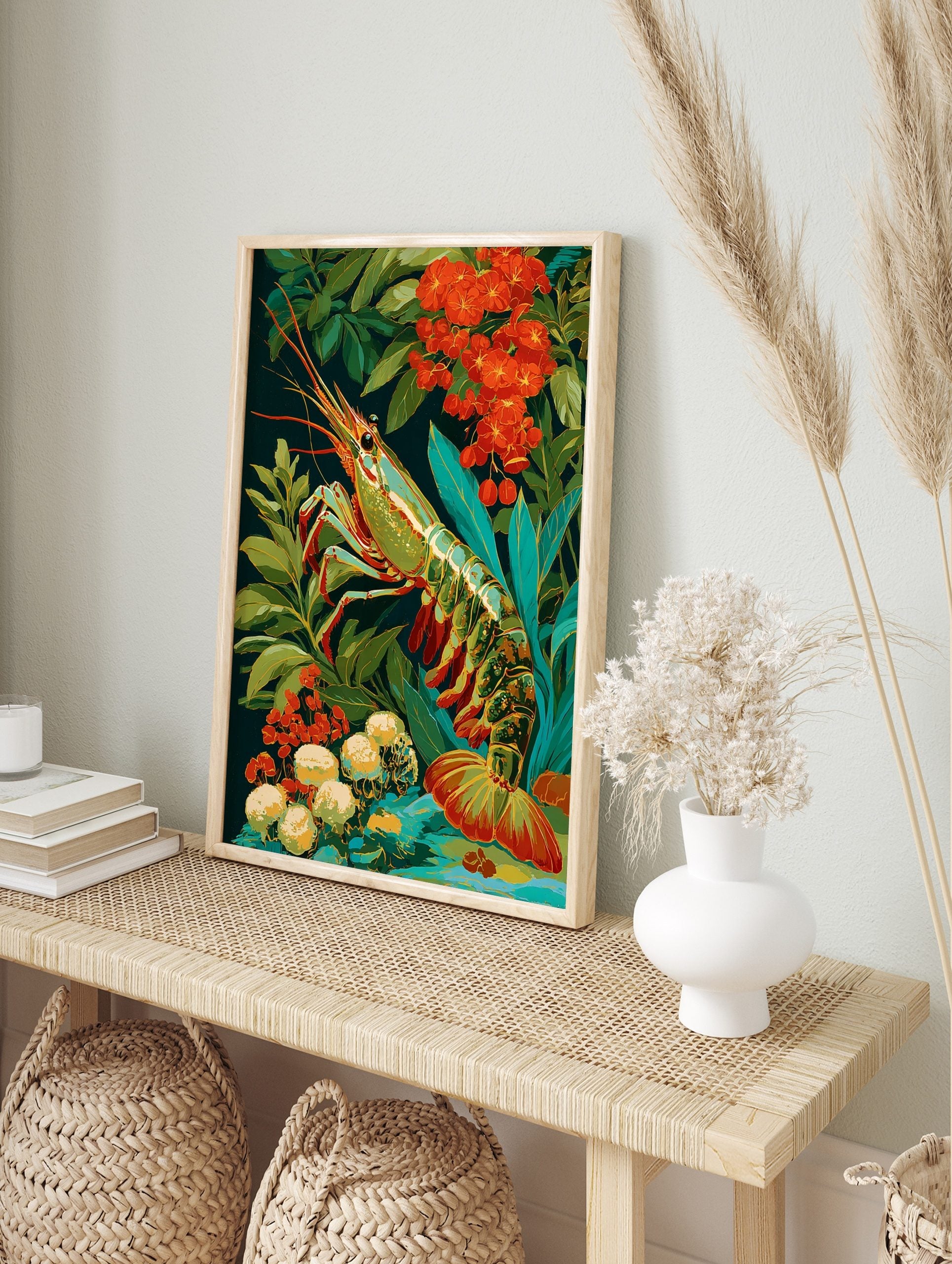 Vibrant prawn illustration with green, blue, and gold shell, surrounded by red flowers and, in an alternate framed mockup
