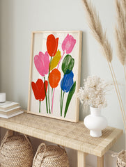 Vibrant tulip bouquet illustration with red, pink, orange, blue, and yellow flowers on a, in an alternate framed mockup